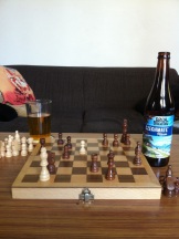 Bach Brewing - Czechmate Pilsner next to a finished game of chess